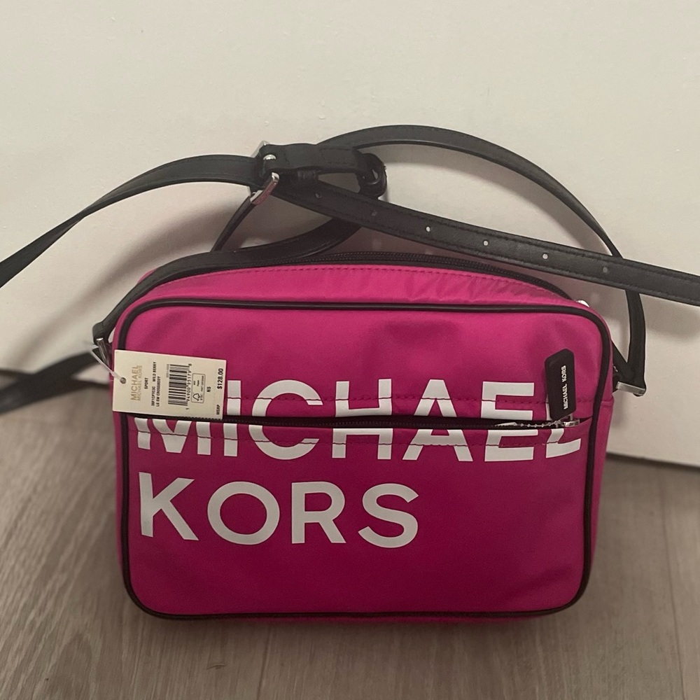 Neon pink Michael Kors crossbody bag